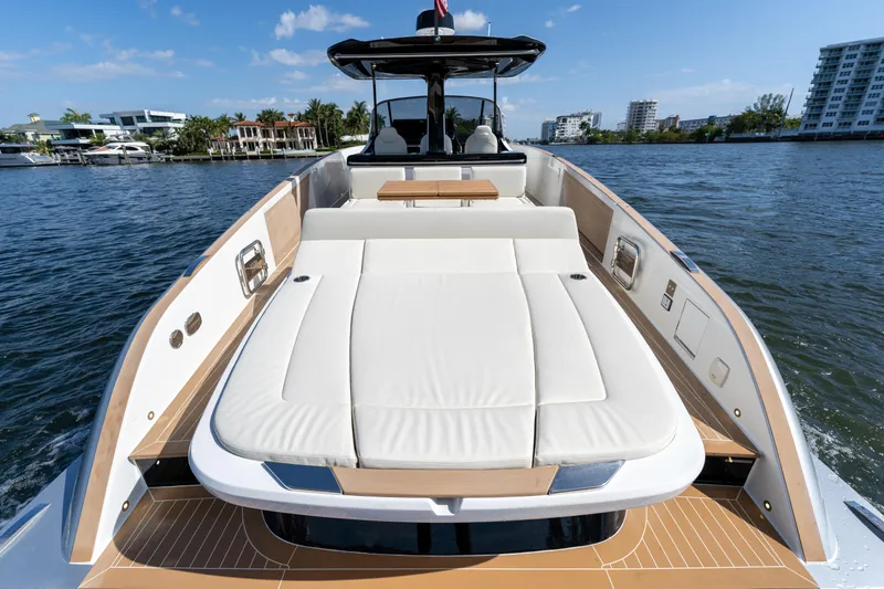  Yacht Photos Pics 2025 Solaris Power 44 Open yacht with spacious sunbed on calm water.