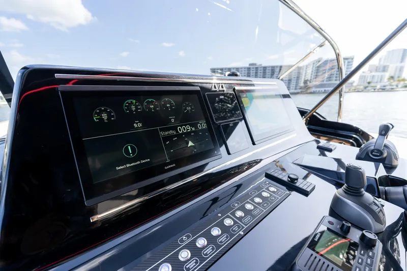  Yacht Photos Pics Control panel of 2025 Solaris Power 44 Open yacht with digital displays and navigation controls.