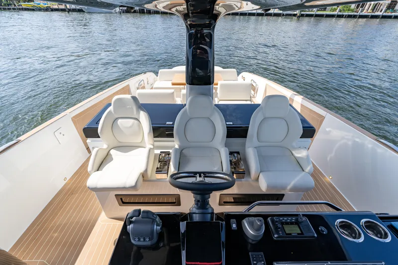  Yacht Photos Pics 2025 Solaris Power 44 Open yacht interior with luxurious seating and modern helm controls.