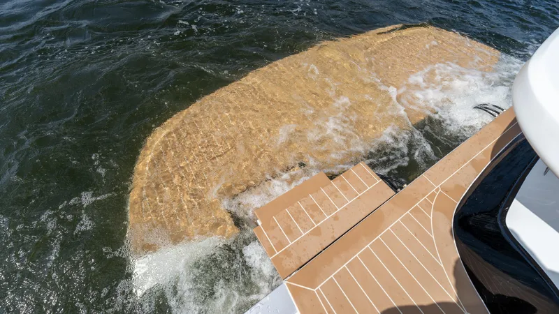  Yacht Photos Pics 2025 Solaris Power 44 Open yacht with teak swim platform in water.