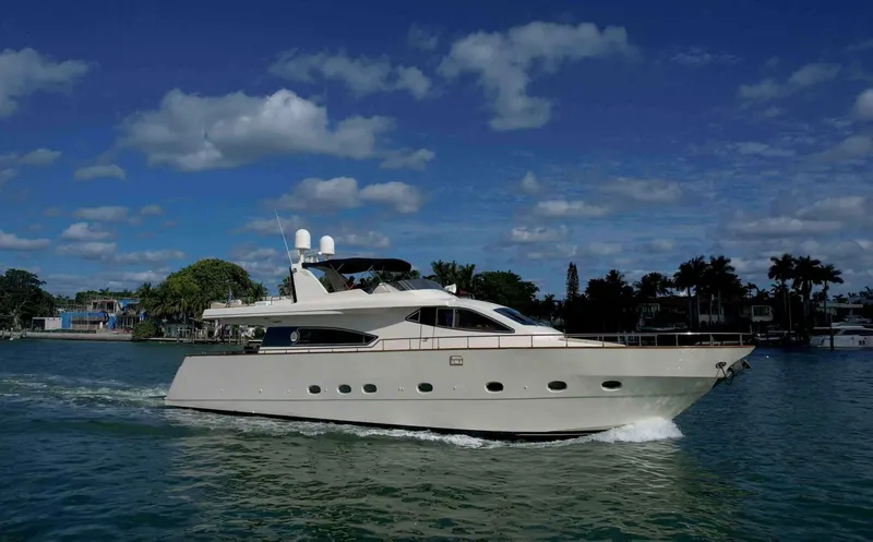 Boulos Yacht Photos Pics Luxurious 2003 Gianetti 86 yacht cruising on a sunny day with blue skies.