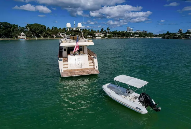 Boulos Yacht Photos Pics Luxury Gianetti 86 yacht and small boat on serene water, 2003 model.
