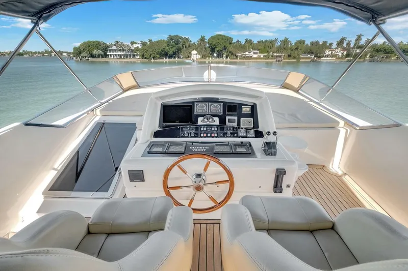 Boulos Yacht Photos Pics Luxurious 2003 Gianetti 86 yacht helm with dual seats and scenic waterfront view.