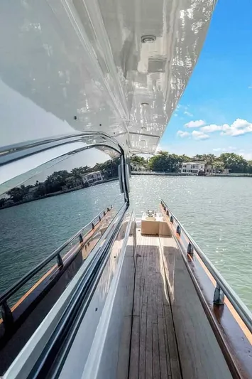 Boulos Yacht Photos Pics Side view of 2003 Gianetti 86 yacht on calm water under blue sky.