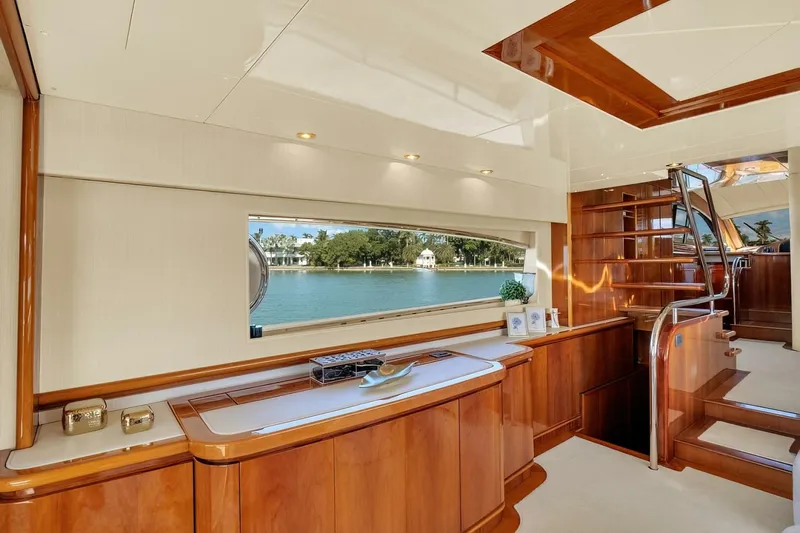 Boulos Yacht Photos Pics Luxurious interior of 2003 Gianetti 86 yacht with elegant wood finishes and scenic window view.