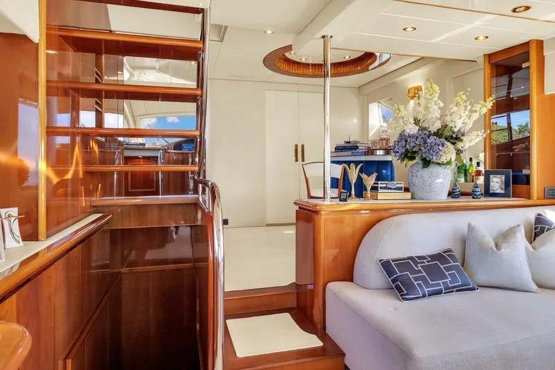 Boulos Yacht Photos Pics Luxurious interior of 2003 Gianetti 86 yacht with elegant wood finishes and plush seating.