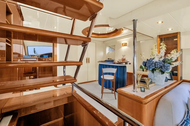 Boulos Yacht Photos Pics Luxurious interior of 2003 Gianetti 86 yacht with elegant wood finishes and floral decor.