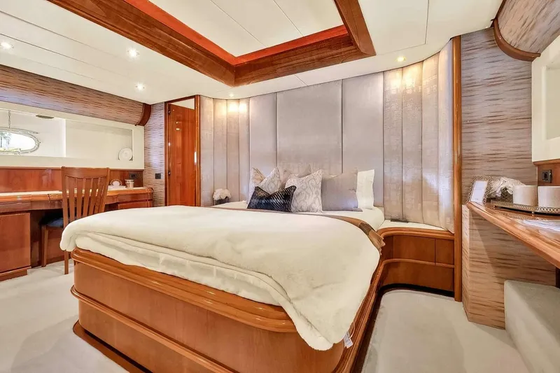 Boulos Yacht Photos Pics Luxurious bedroom interior on 2003 Gianetti 86 yacht, featuring elegant wood finishes and plush bedding.