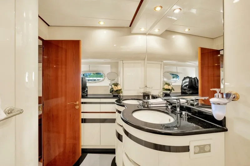 Boulos Yacht Photos Pics Luxurious bathroom in 2003 Gianetti 86 yacht with elegant fixtures and wood accents.