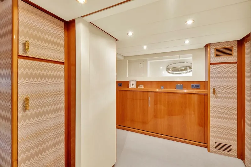 Boulos Yacht Photos Pics Luxurious interior of 2003 Gianetti 86 yacht with wood paneling and modern lighting.