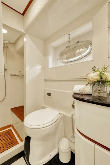 Boulos Yacht Photos Pics Luxurious bathroom in 2003 Gianetti 86 yacht with modern fixtures and elegant decor.