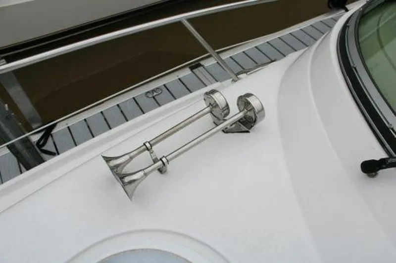  Yacht Photos Pics 2011 Four Winns V335 boat deck with dual trumpet horns and railing.