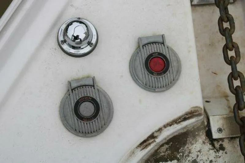  Yacht Photos Pics Control panel on a 2011 Four Winns V335 boat with chain and buttons.