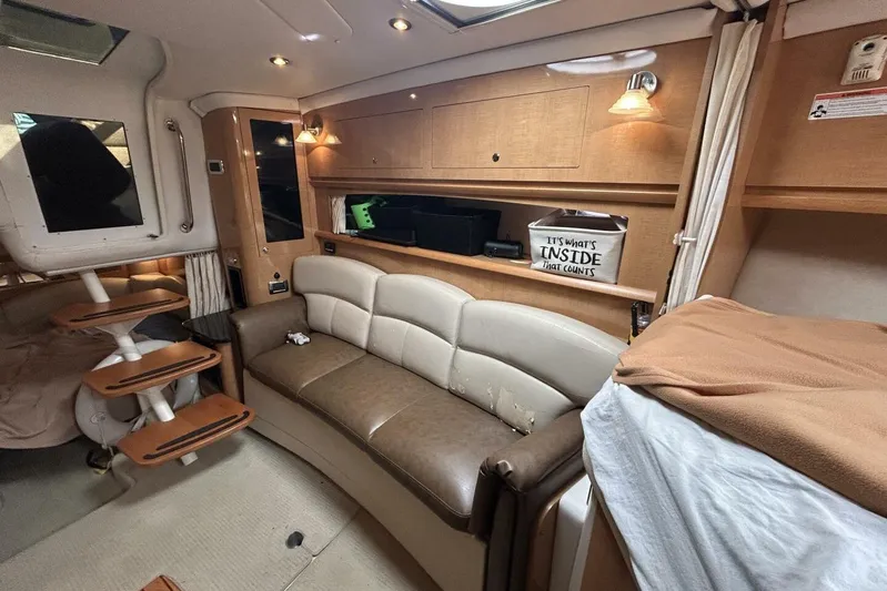  Yacht Photos Pics Interior of 2011 Four Winns V335 boat with cozy seating and wooden accents.