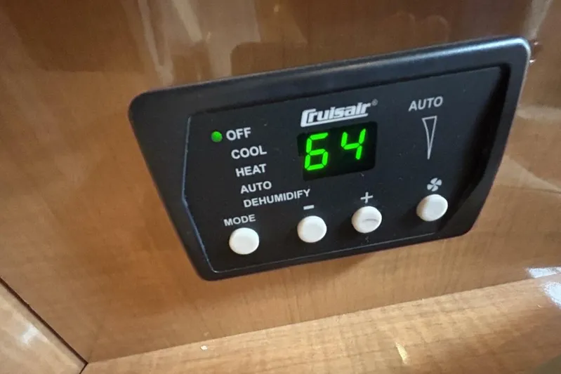  Yacht Photos Pics Cruisair control panel displaying 64 degrees on a 2011 Four Winns V335 boat.