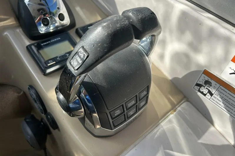  Yacht Photos Pics Throttle controls on a 2011 Four Winns V335 boat dashboard.