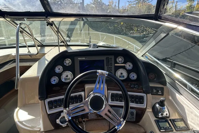  Yacht Photos Pics 2011 Four Winns V335 boat dashboard with steering wheel and control gauges.