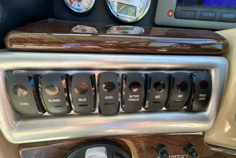  Yacht Photos Pics Control panel of a 2011 Four Winns V335 boat with labeled switches.