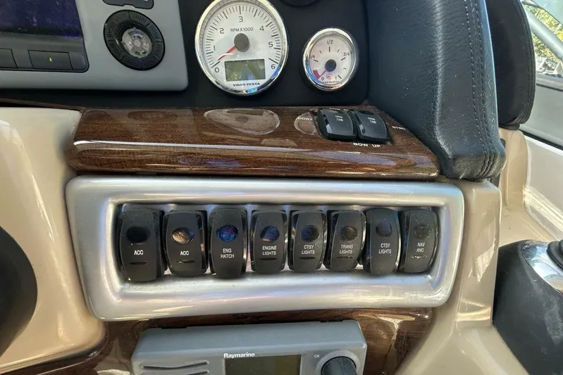  Yacht Photos Pics Control panel of a 2011 Four Winns V335 boat with switches and gauges.