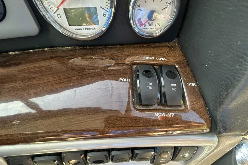  Yacht Photos Pics 2011 Four Winns V335 dashboard with Volvo Penta gauges and trim tab controls.