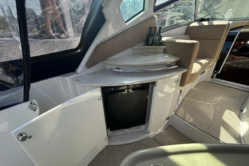  Yacht Photos Pics Interior of 2011 Four Winns V335 boat with seating and storage area.