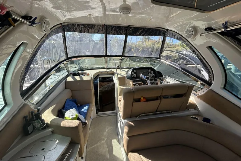  Yacht Photos Pics Interior of 2011 Four Winns V335 boat with seating and steering console.