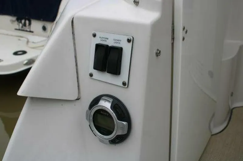  Yacht Photos Pics Control panel on a 2011 Four Winns V335 boat, featuring switches and a digital display.