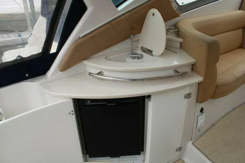  Yacht Photos Pics 2011 Four Winns V335 boat interior with kitchenette and seating area.