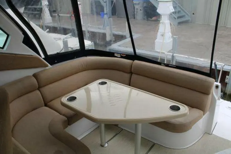  Yacht Photos Pics Interior of 2011 Four Winns V335 boat with beige seating and table.