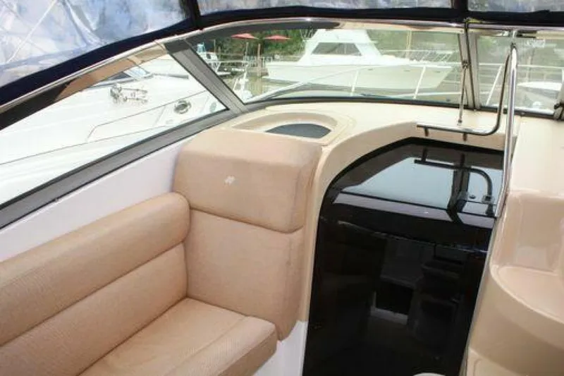  Yacht Photos Pics Interior of 2011 Four Winns V335 boat with beige seating and sleek design.