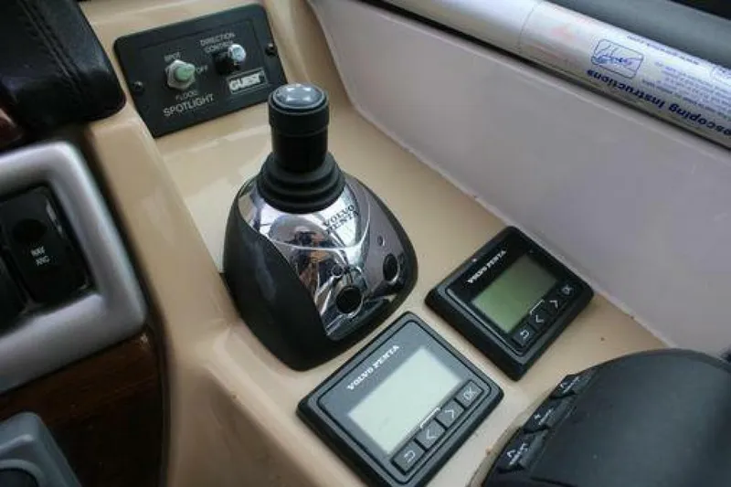  Yacht Photos Pics Control panel of a 2011 Four Winns V335 boat with joystick and digital displays.