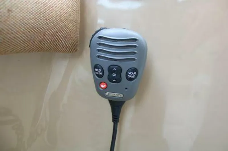  Yacht Photos Pics Handheld radio microphone on 2011 Four Winns V335 boat dashboard.