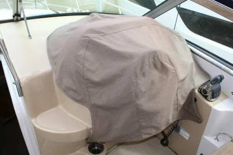  Yacht Photos Pics 2011 Four Winns V335 boat helm covered with protective fabric.