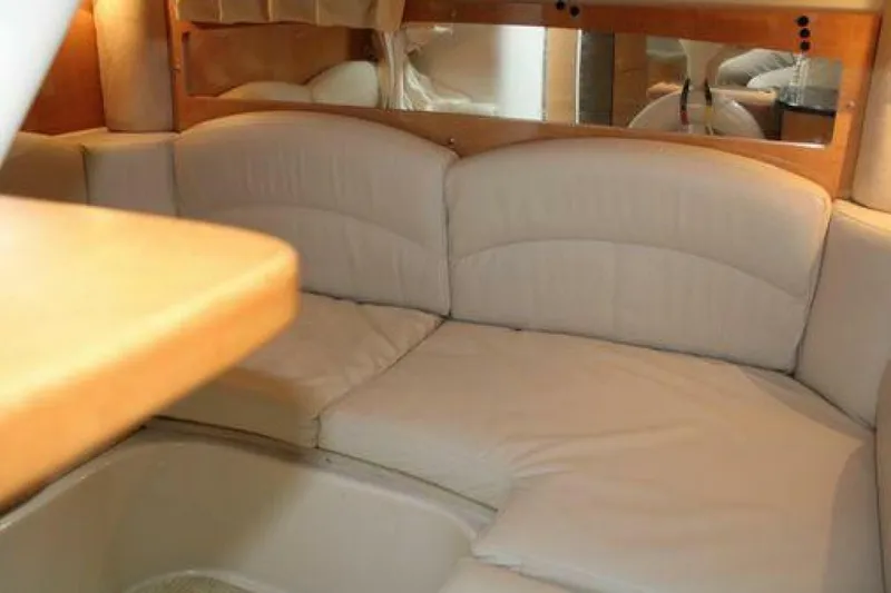  Yacht Photos Pics Interior of 2011 Four Winns V335 boat with beige seating and wooden accents.