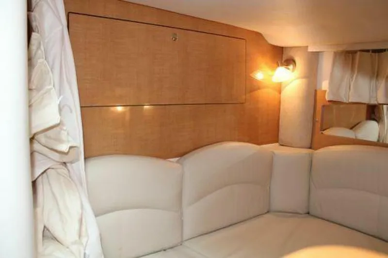  Yacht Photos Pics Interior cabin of 2011 Four Winns V335 boat with cozy seating and ambient lighting.