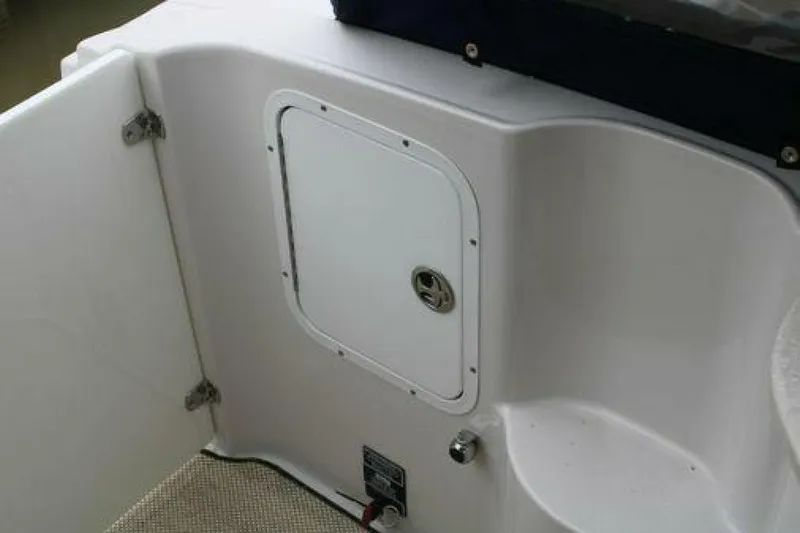  Yacht Photos Pics 2011 Four Winns V335 boat interior compartment with open door.