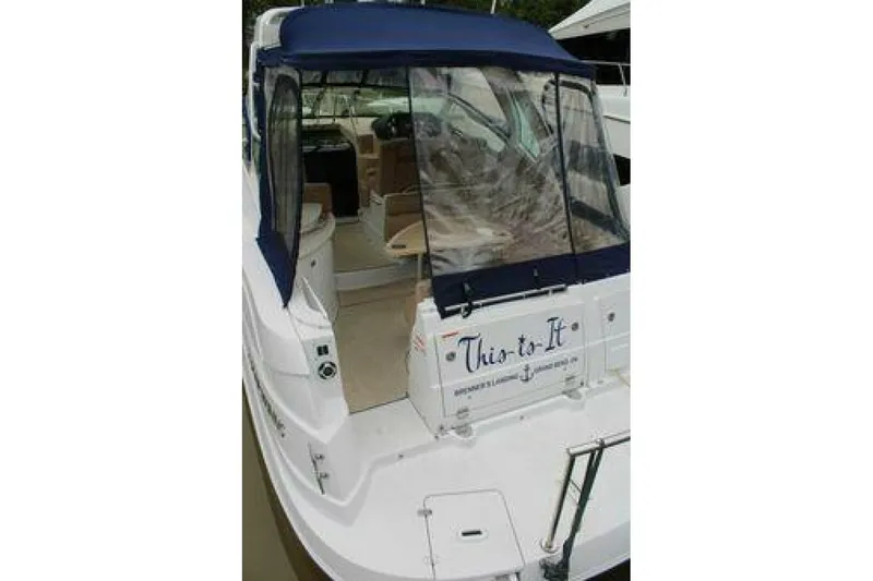  Yacht Photos Pics 2011 Four Winns V335 boat with blue canopy and rear deck view.