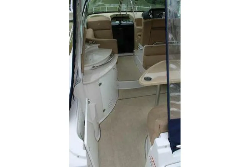  Yacht Photos Pics Interior view of 2011 Four Winns V335 boat, featuring seating and helm area.