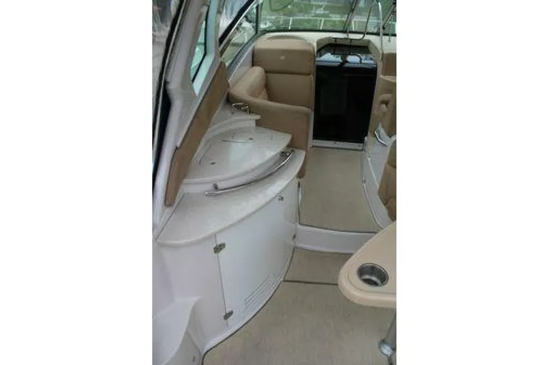  Yacht Photos Pics Interior of 2011 Four Winns V335 boat with beige seating and compact design.