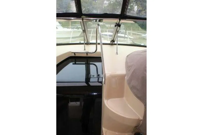  Yacht Photos Pics Interior view of 2011 Four Winns V335 boat cockpit with seating and windows.
