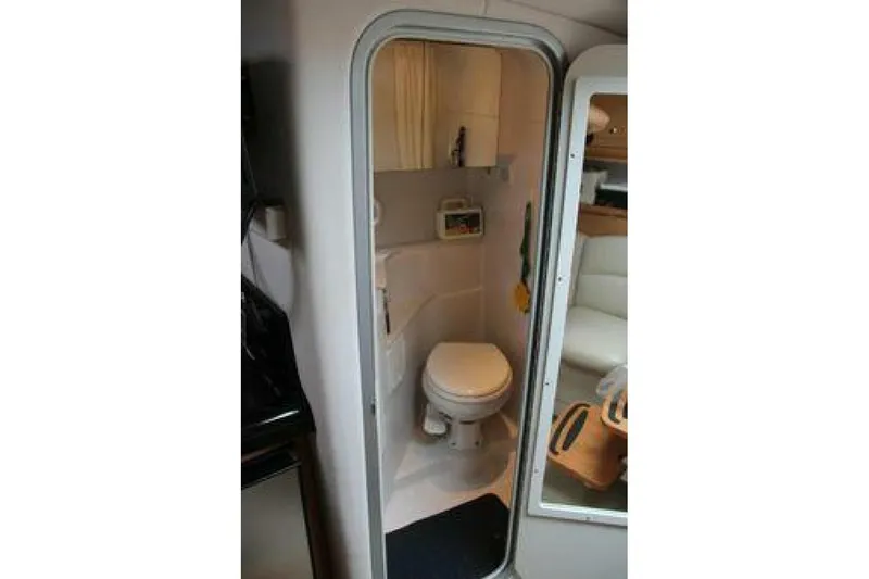  Yacht Photos Pics 2011 Four Winns V335 boat bathroom interior with toilet and compact design.