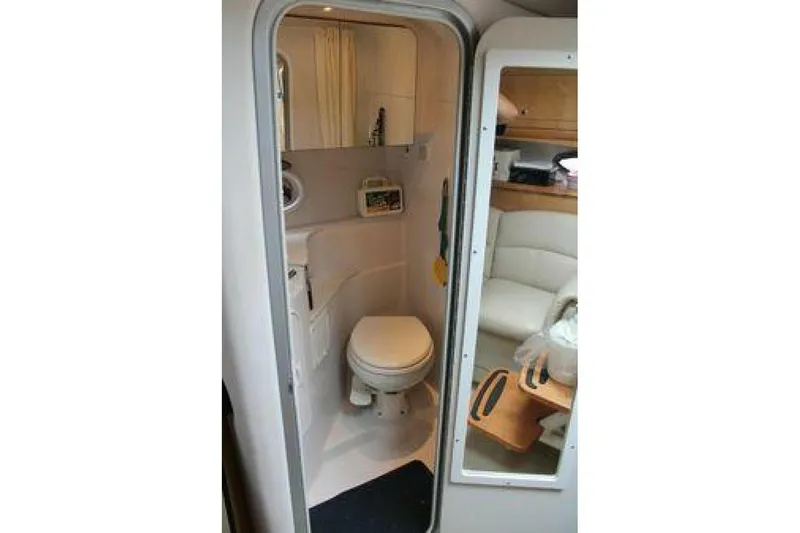  Yacht Photos Pics 2011 Four Winns V335 boat interior bathroom with toilet and seating area.