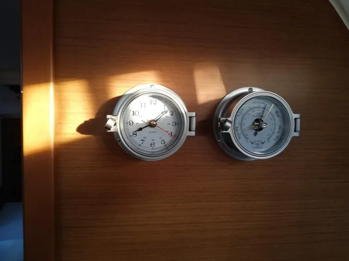  Yacht Photos Pics Wall-mounted clock and barometer on Jeanneau Sun Odyssey 410 yacht, 2020 model.