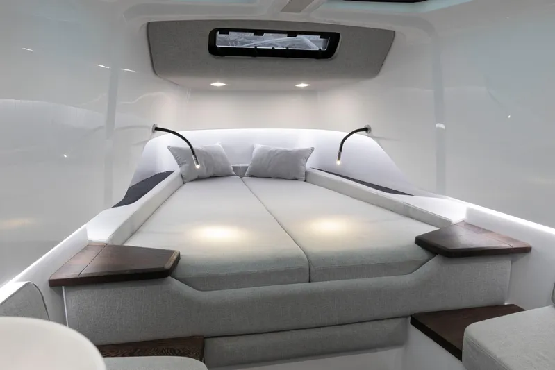  Yacht Photos Pics Luxurious interior of 2025 Axopar 37XC CROSS CABIN BRABUS Trim with modern bedding.