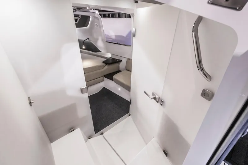  Yacht Photos Pics 2025 Axopar 37XC CROSS CABIN BRABUS interior with modern seating and sleek design.