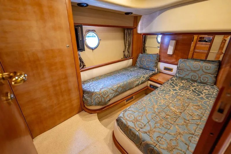All In Yacht Photos Pics Luxurious cabin interior of 2010 Azimut 62 Evolution Fly yacht with twin beds.