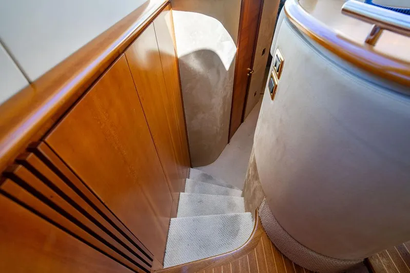 All In Yacht Photos Pics Interior staircase of 2010 Azimut 62 Evolution Fly yacht with wooden paneling.