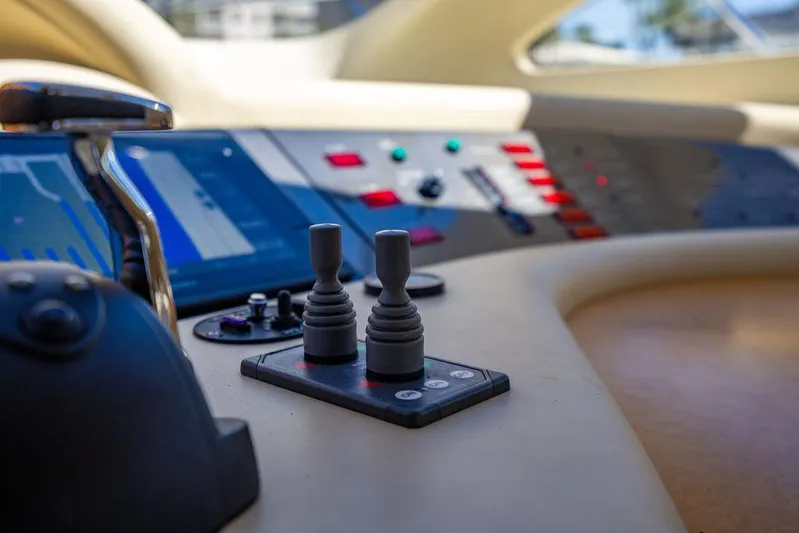 All In Yacht Photos Pics Control panel of 2010 Azimut 62 Evolution Fly yacht with joysticks and digital displays.