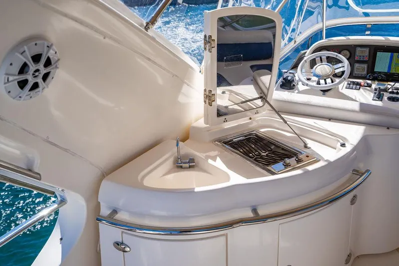 All In Yacht Photos Pics Luxurious 2010 Azimut 62 Evolution Fly yacht interior with helm and kitchenette.