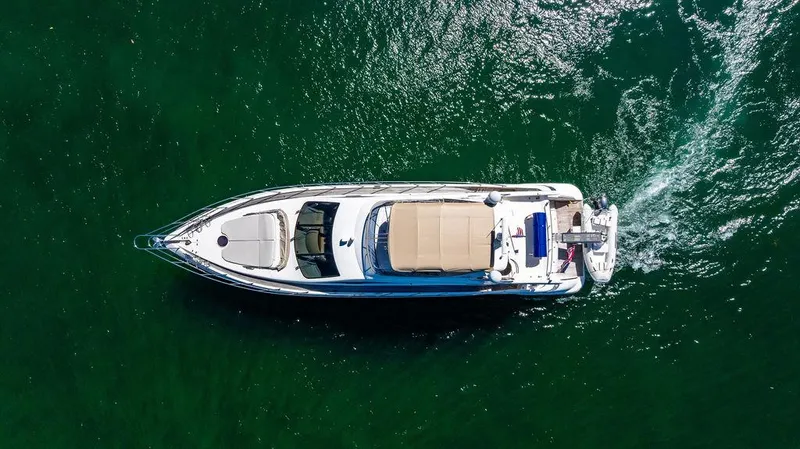 All In Yacht Photos Pics Aerial view of 2010 Azimut 62 Evolution Fly yacht cruising on green water.